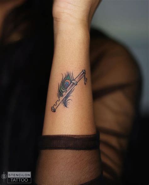 Peacock Feather With Flute Tattoo Wrist Tattoos For Guys Hand