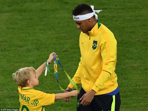 Neymar Walks On The Pitch With His Young Son Who Holds His Fathers