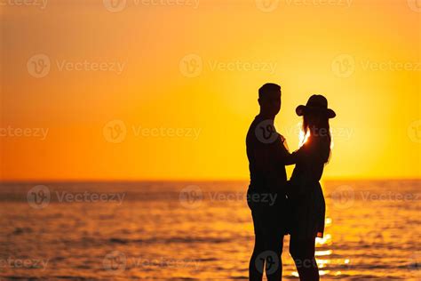 Romantic couple on the beach 18044011 Stock Photo at Vecteezy