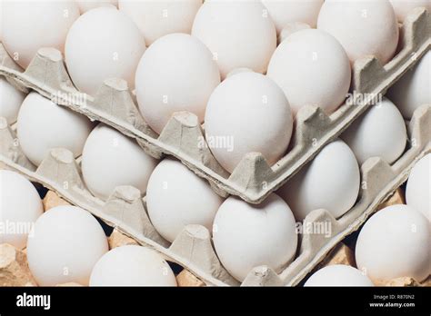 Several white eggs in an egg carton Stock Photo - Alamy