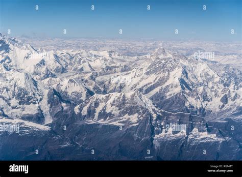 Aerial view of the snow capped Himalayas mountain in Nepal from a plane ...