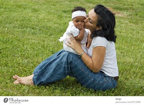 A white women with a black baby - a Royalty Free Stock Photo from Photocase