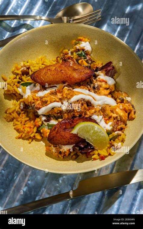 Jamaican Jerk Chicken Rice Bowl With Sweet Plantains And Hot Sauce