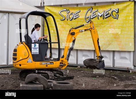 Young Girl Using Jcb Mini Excavator At National Eisteddfod 2010 Ebbw Vale Blaenau Gwent South