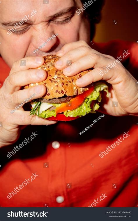 Fat Person Eating A Burger