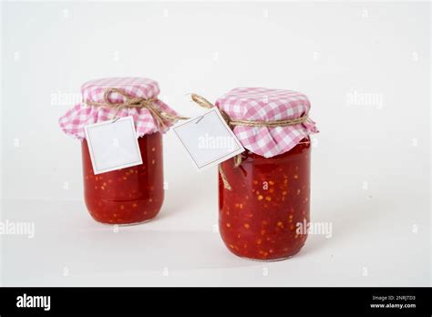 Two Canned Homemade Tomato Paste Jars With Empty Labels Isolated On