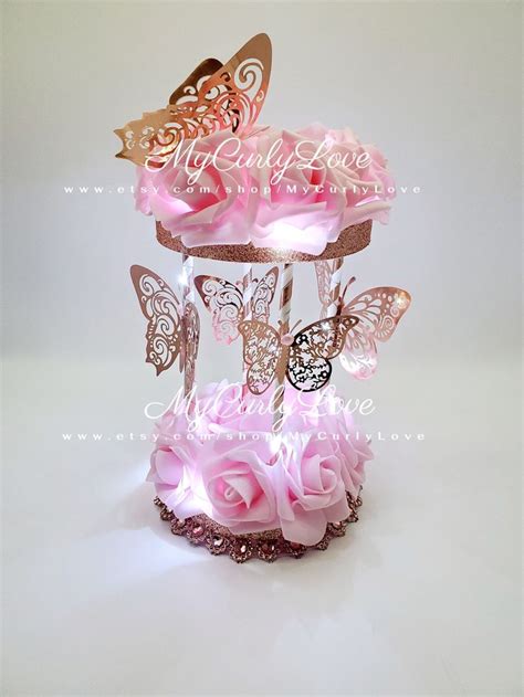 Pink Roses And Butterflies In A Glass Vase