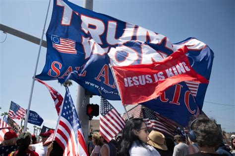 100 Trump Supporters Rally At The Huntington Beach Pier A Day After Pennsylvania Shooting