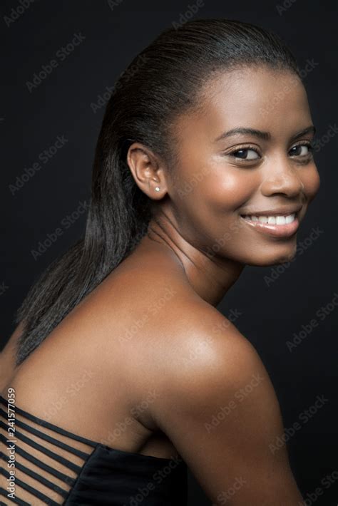 Profile Of A Beautiful Young Black Woman Wearing A Sexy Black Bikini