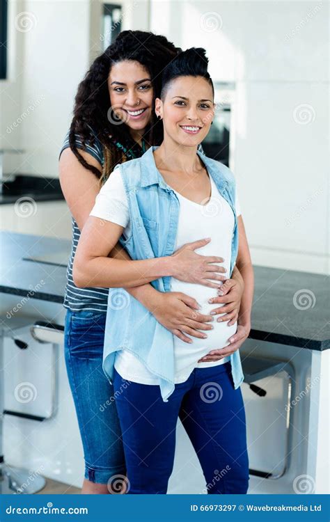 Pregnant Lesbian Couple Standing Back To Back Royalty Free Stock