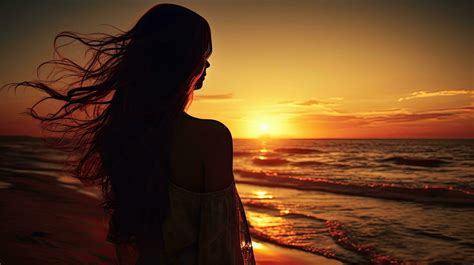 Woman s silhouette watching beach sunset 27104693 Stock Photo at Vecteezy