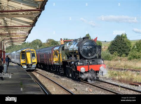 The LMS Royal Scot class 46115 Scots Guardsman and a modern diesel train at Hellifield station ...