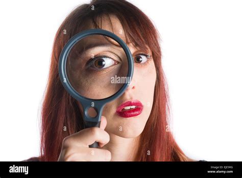 Young Woman Looking Through Magnifying Glass Stock Photo Alamy