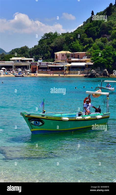 Boat With A Painted Blue Eye Arriving At Agios Spiridon Beach Agios