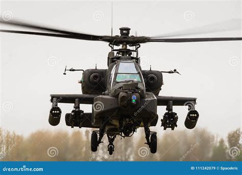 A Hovering Apache Attack Gunship Helicopter Stock Image - Image of ...