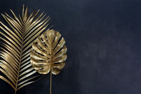 Premium Photo Collection Of Tropical Leaves In Gold Color On Black