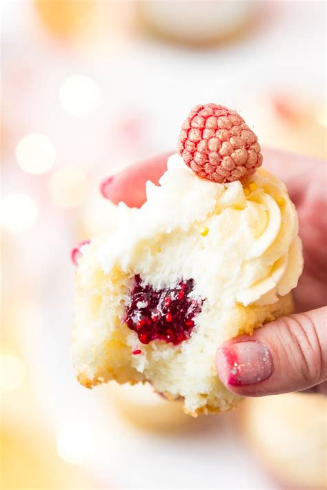 Raspberry Filled Cupcakes With White Chocolate Frosting Raspberry