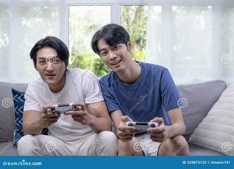 Asian Gay Lgbt Men Couple Play Video Games At Home Males Having Funny