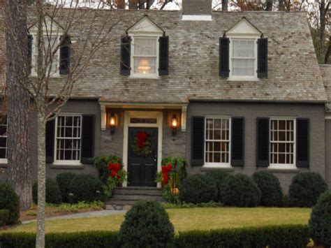 Transform Your Curb Appeal With A Tan Brick House And Bold Black Shutters