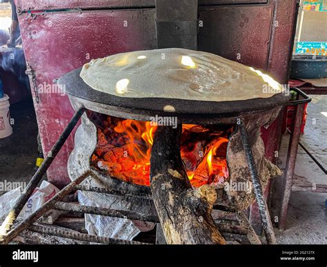 Flour Tortillas Cooked On A Steel Comal With The Fire Of The Mesquite