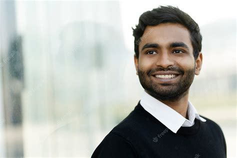 Premium Photo Portrait Of Handsome Smiling Indian Businessman Looking Away On The Street