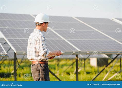 Engineer On Building Roof Checking Solar Panels Stock Photo Image Of