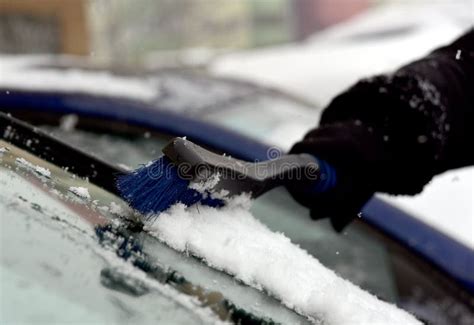 Removing Snow From Car Windshield Clean Car Window In Winter From Snow