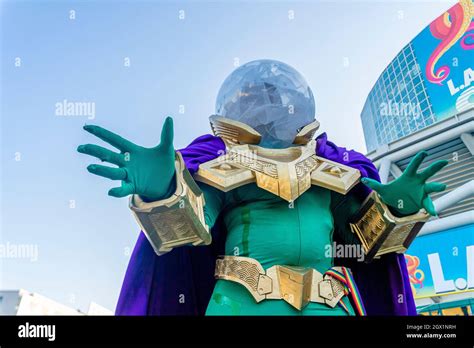 Attendee portraying Mysterio character in colorful costume, at Comic Con in Los Angeles, CA ...