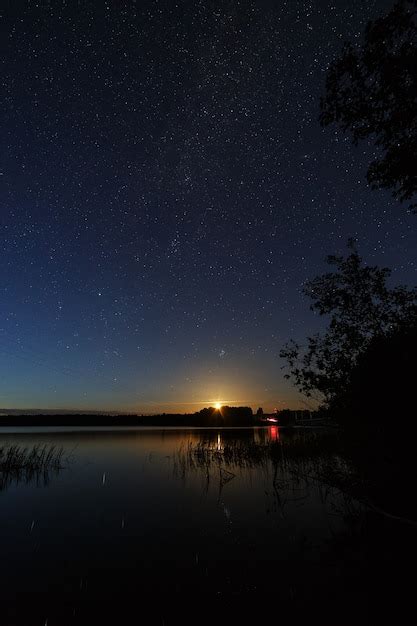 Premium Photo The Stars In The Night Sky Over The River