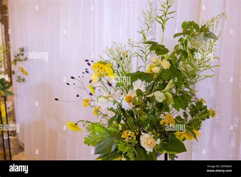 Arch For The Wedding Ceremony Decorated With Cloth Flowers And