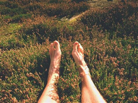 Premium Photo Naked Male Legs On Peak Make Step Sandstone Rock Above