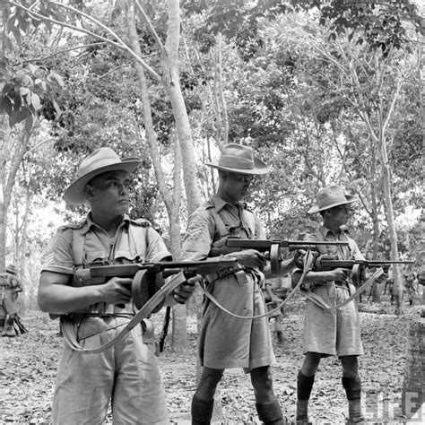 A Royal Malay Regiment Lewis Machine Gunner Taking A Break During