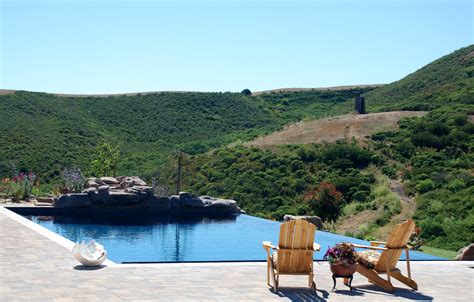 Beach Style Infinity Pool With Natural Rock Waterfall Modern Pool