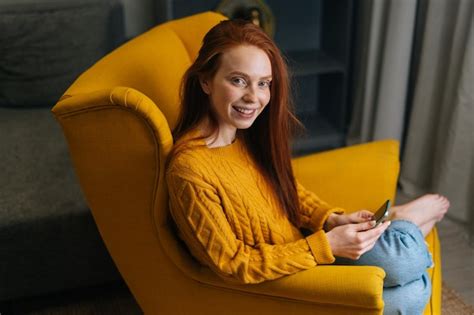 Premium Photo Highangle View Of Positive Young Woman Using Smartphone