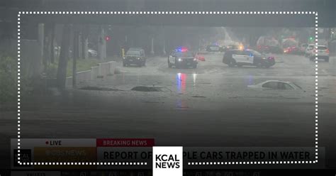 4 cars trapped in rising flood waters in Long Beach - CBS Los Angeles