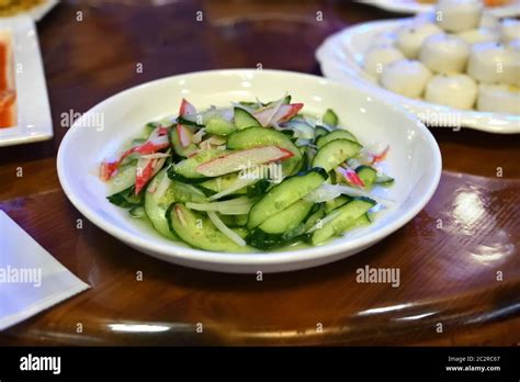 North Korean snacks. Spicy vegetable salad of cucumbers, radish and cornflower-blue root with ...