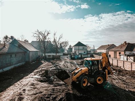 Premium Photo | An excavator is digging foundation on construction site