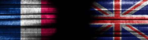 Premium Photo France And United Kingdom Flags On Black Background