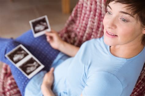 Premium Photo Pregnant Woman Looking At Ultrasound Scans