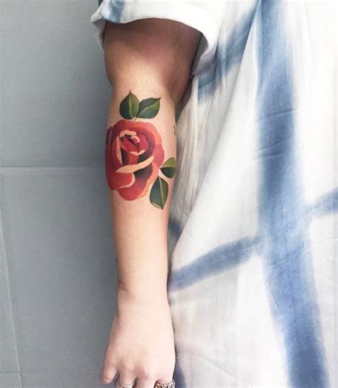 Illustrative Red Rose Tattoo On The Right Forearm