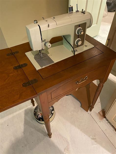 Sold Price VINTAGE SEARS KENMORE MODEL 2142 SEWING MACHINE WITH TABLE