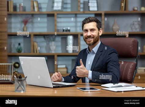 Portrait Of Mature Successful Investor Businessman In Business Suit Working Inside Office Using