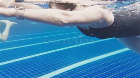 Under Water View Of Professional Female Swimmer Woman Athlete Swimmer