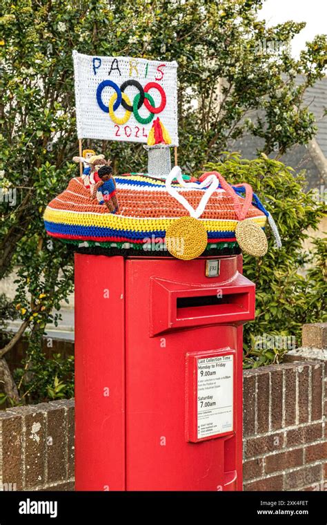 Colourful Knitted Post Box Topper Celebrating The Paris 2024 Olympics