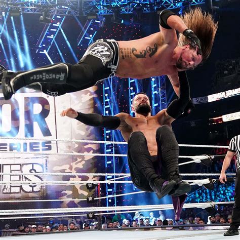 Download "AJ Styles Defying Gravity" Wallpaper | Wallpapers.com