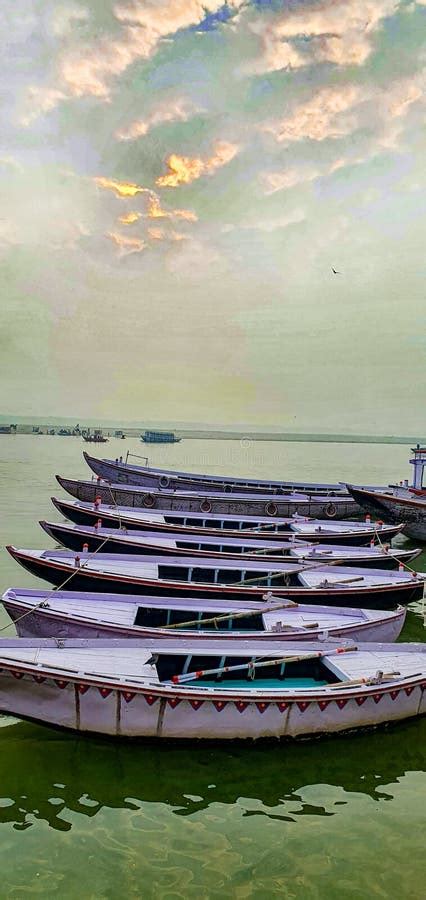 Boats Anchored On The Ganges Ganga River Banks In Varanasi India