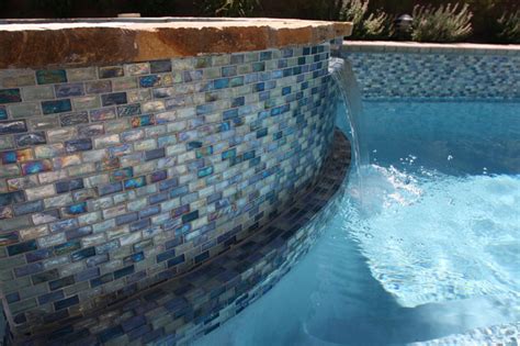 Iridescent Blue 1” X 2” Glass Tile Surrounds The Pool And Raised Spa On The Rai Modern Pool