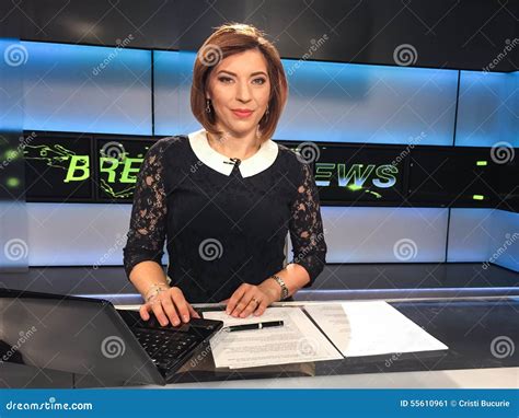 TV Reporter At The News Desk Stock Photo - Image: 55610961