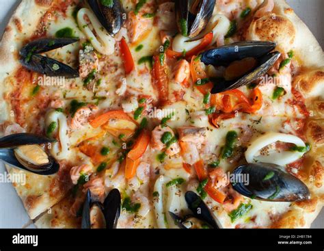 Crispy Seafood Pizza With Mussels Squid And Shrimps Stock Photo Alamy