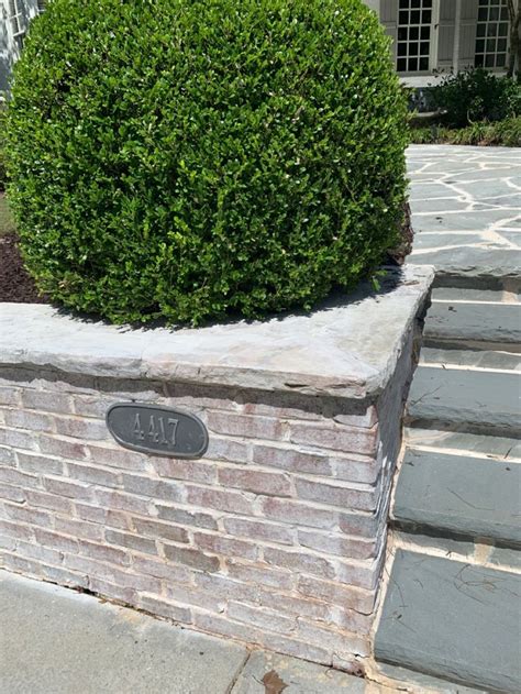 Limewashed brick retaining wall | Lime wash brick, Brick garden, Patio stones